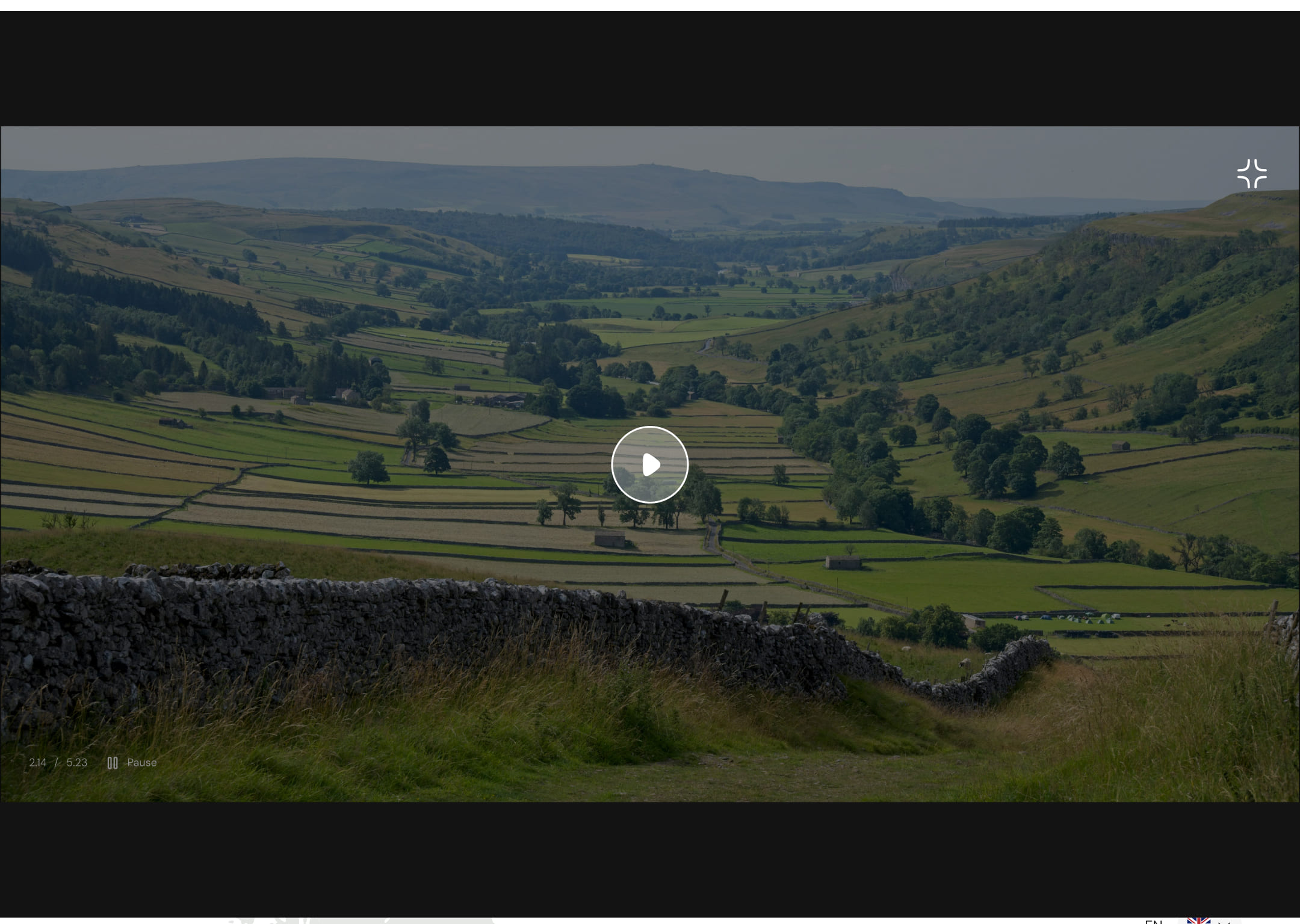 Homepage of a tour service site featuring hiking trails in England - video presentation section. The video is paused, the player view is expanded to cover up most of the screen.
